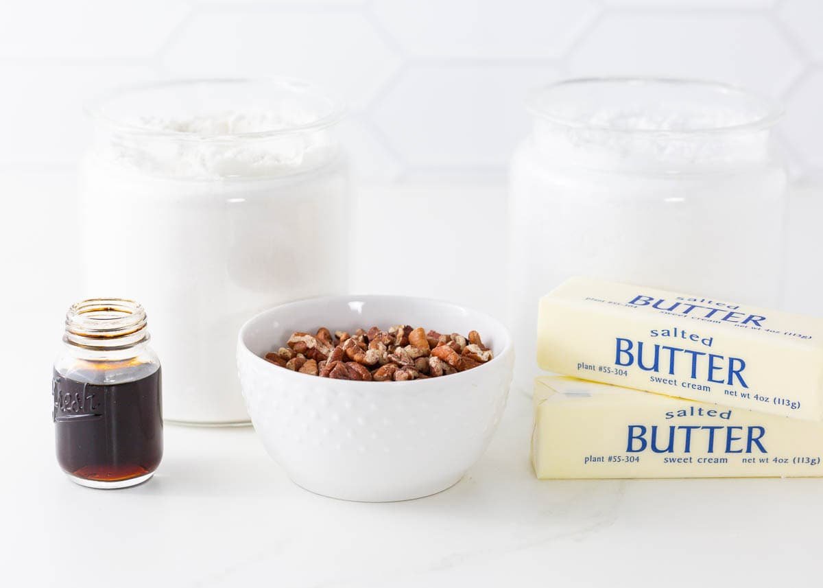 Snowball cookies are a holiday classic made with buttery shortbread studded with crunchy pecans and coated in powdered sugar. Perfect for Christmas cookie trays! Snowball cookie ingredients.