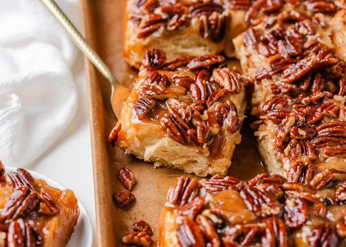 Warm, gooey, and dripping in a maple caramel glaze and pecan topping, these homemade sticky buns are the perfect bake for your next holiday brunch or cozy weekend morning!