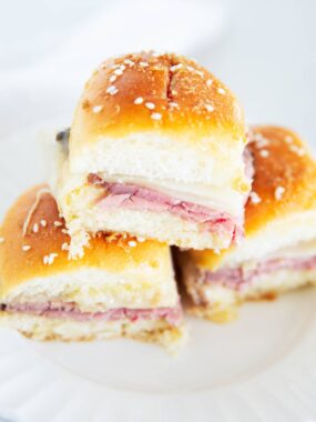 Stacked roast beef sliders.