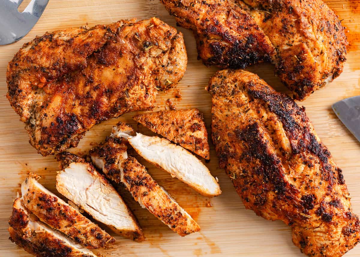 Make perfectly seasoned blackened chicken with a smoky crust and tender, juicy middle. Serve it over creamy Alfredo, rice, or salad for an easy way to add big flavor to any dinner. Blackened chicken breasts on a cutting board with tender slices arranged beside them
