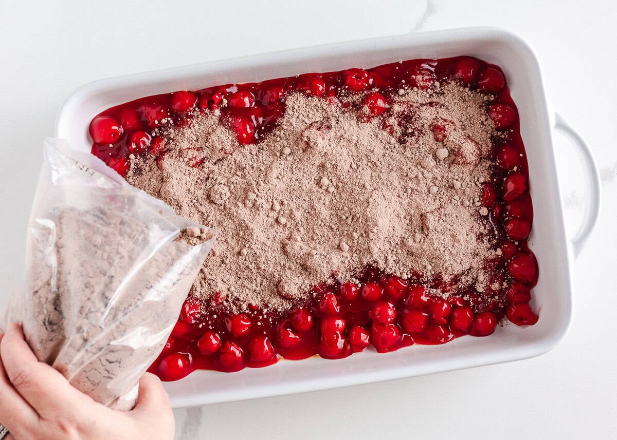 Rich, gooey, and packed with chocolate cherry flavor, this chocolate cherry dump cake is made with only 4 ingredients and minimal prep. It's a quick and easy indulgent dessert! Sprinkling dry chocolate cake mix evenly over cherry pie filling in a baking dish.