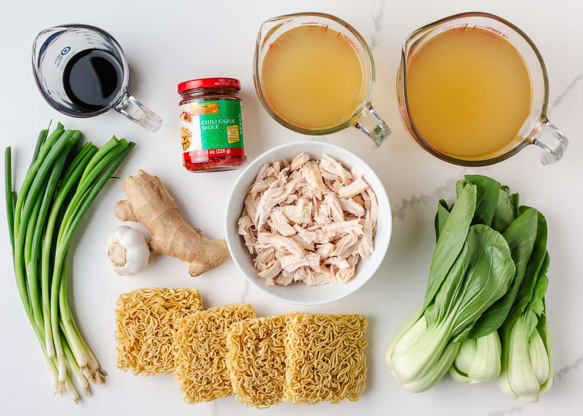 Make this quick and easy homemade chicken ramen with a rich savory broth, tender chicken, noodles, and plenty of your favorite toppings. Ingredients for homemade chicken ramen including chicken broth, ramen noodles, shredded chicken, bok choy, garlic, ginger, soy sauce, and green onions.