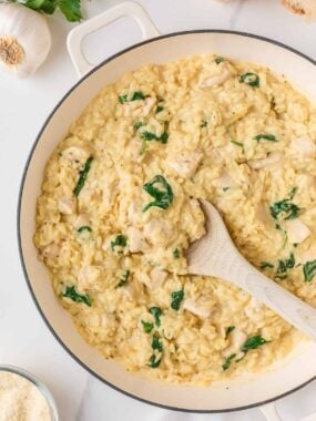 One pot chicken and orzo with tender chicken pieces, orzo pasta, and wilted spinach in a creamy sauce.