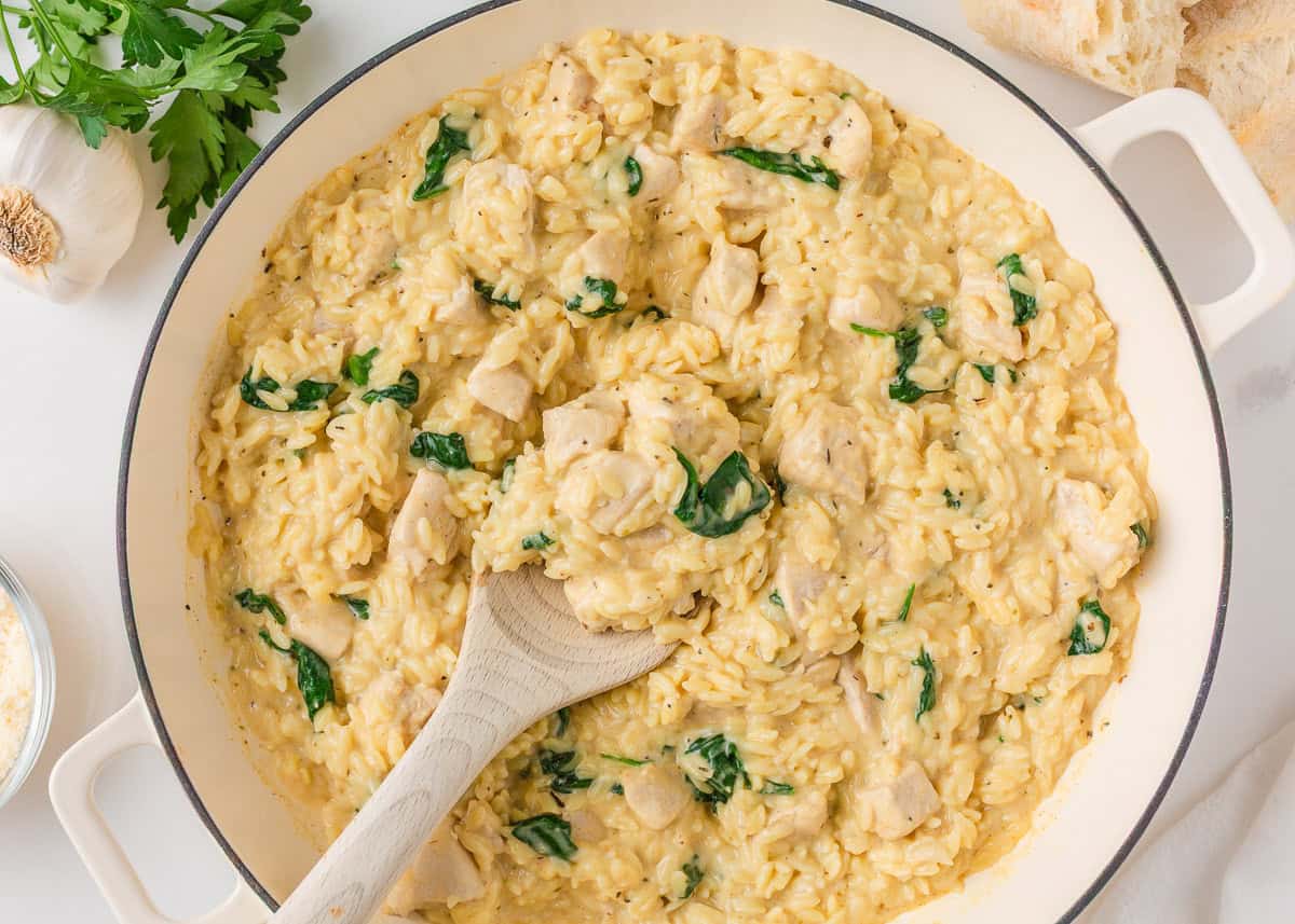 Creamy chicken and orzo cooked in one pan with spinach, garlic, and Parmesan cheese.