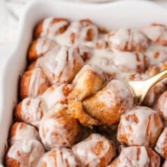 Close-up of gooey cinnamon roll bites with soft centers and melted glaze.