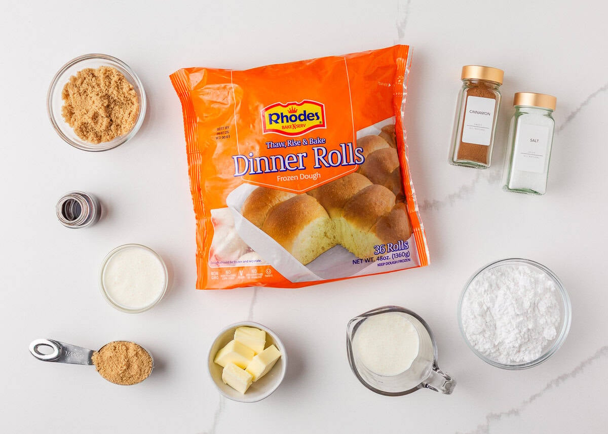 These easy cinnamon roll bites deliver soft, fluffy cinnamon sugar goodness in a bite-sized treat made with ready-made frozen dough. They're perfectly gooey for a sweet treat! Ingredients for cinnamon roll bites including Rhodes rolls, brown sugar, cinnamon, cream, and powdered sugar.