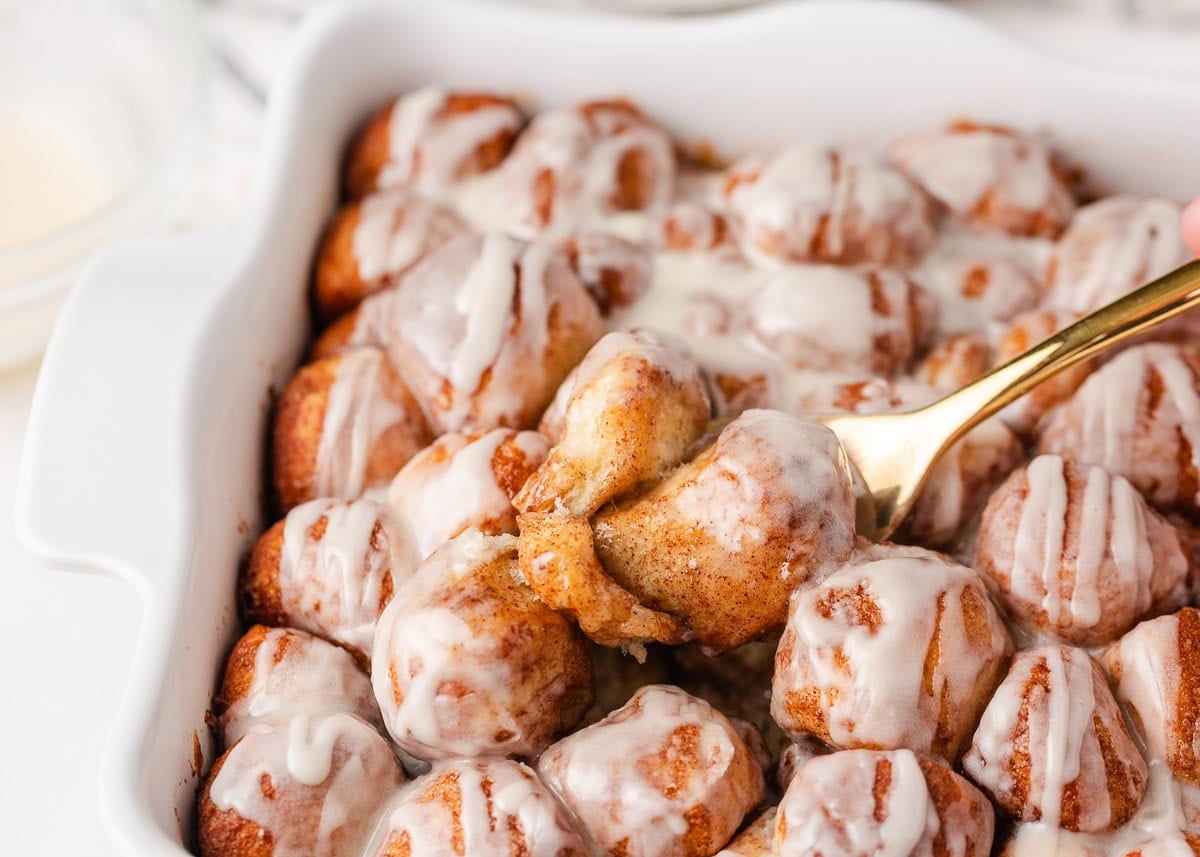 Close-up of gooey cinnamon roll bites with soft centers and melted glaze.