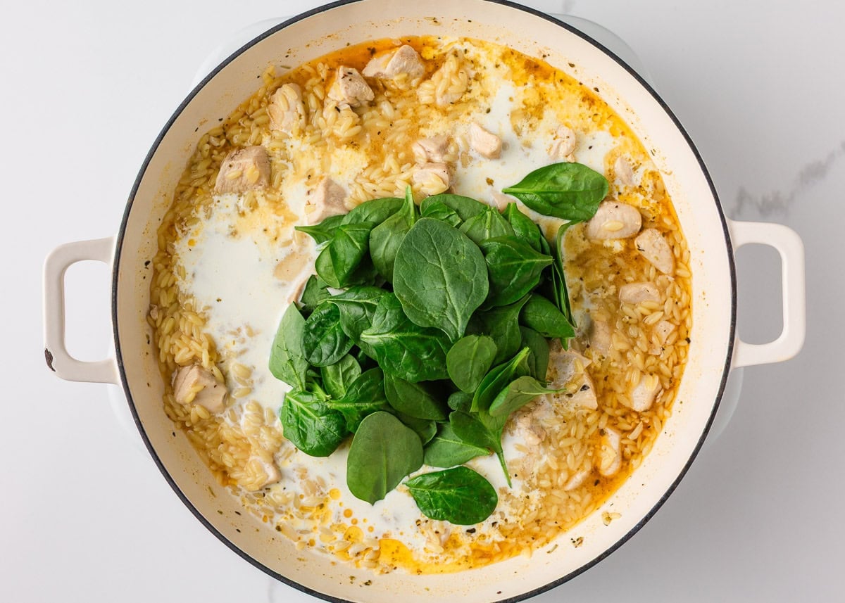 Heavy cream and fresh spinach added to chicken and orzo to create a creamy sauce.