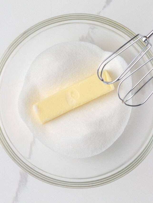 This sour cream banana bread is extra soft, moist, and full of flavor thanks to one simple ingredient. It’s an easy recipe and the perfect way to use up overripe bananas. Mixing butter and sugar as the first step for banana sour cream bread.