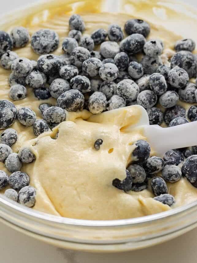 Fresh blueberries tossed in flour and folded into lemon cake batter for lemon blueberry layer cake.