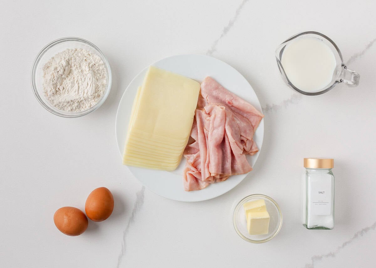 Ham and cheese crepes are made with slices of delicious ham and melted cheese and served with the option of juicy cherry tomatoes. A delicious savory crepe that's so simply made, it's perfect for breakfast, lunch, dinner, and everything in between! Ham and cheese crepe ingredients including eggs for crepe batter, flour, milk, butter, deli ham and sliced cheese