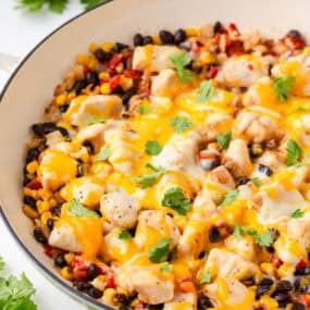 One pan Santa Fe chicken skillet with black beans, corn, tomatoes and fresh cilantro.