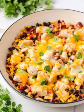 One pan Santa Fe chicken skillet with black beans, corn, tomatoes and fresh cilantro.