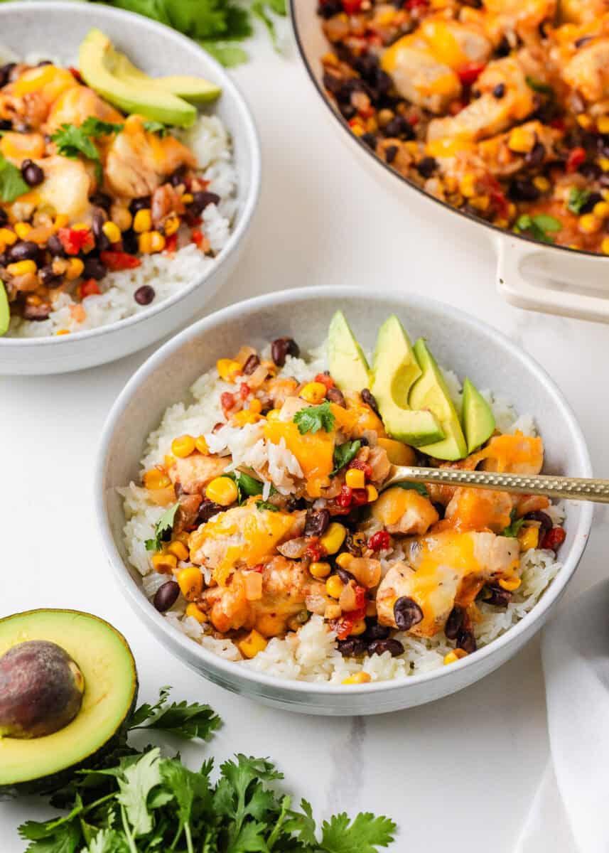 Santa Fe chicken served over rice with black beans, corn, melted cheese, avocado and cilantro.