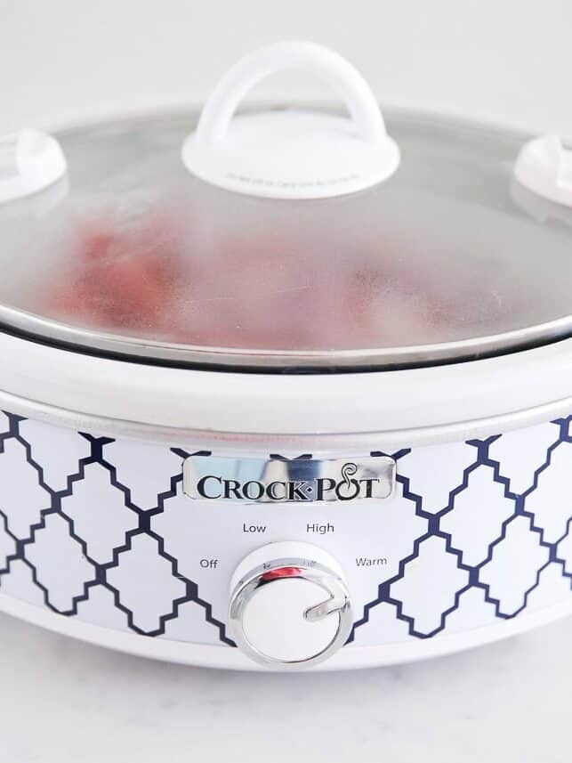 Covered crockpot with the dial set to low.