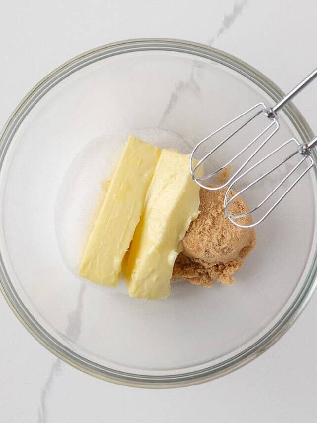 Butter and sugars in a mixing bowl ready to be creamed for orange creamsicle cookies.