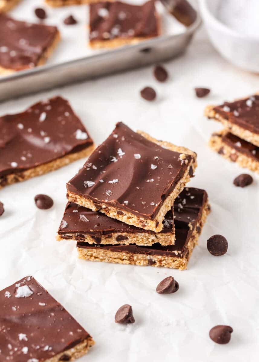 Homemade cookie dough bark squares with a chocolate topping, oat cookie dough layer and flaky sea salt.