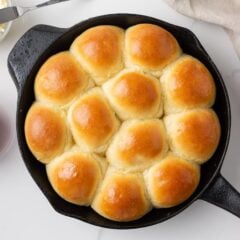 Homemade skillet rolls baked until golden brown and served with butter and jam.