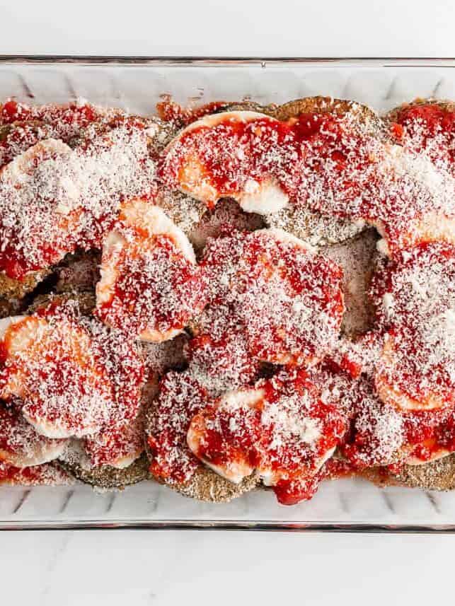 Assembled eggplant parmesan ready to be baked.