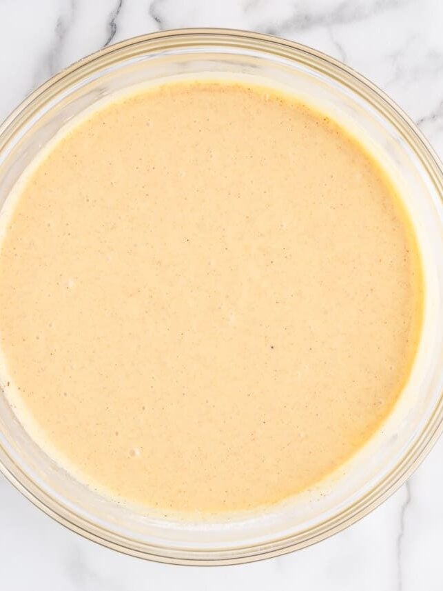 Cake mix batter in bowl for apple pie cupcakes with cake mix.