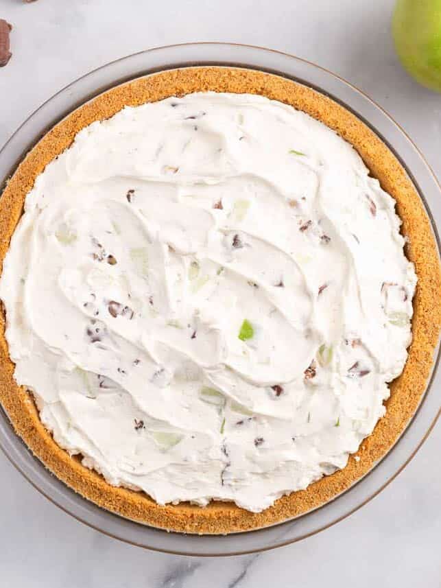 cream mixture inside of graham cracker crust