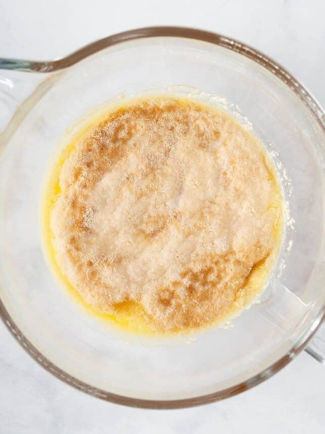 Activated yeast mixture in a glass mixing bowl before making the roll dough.