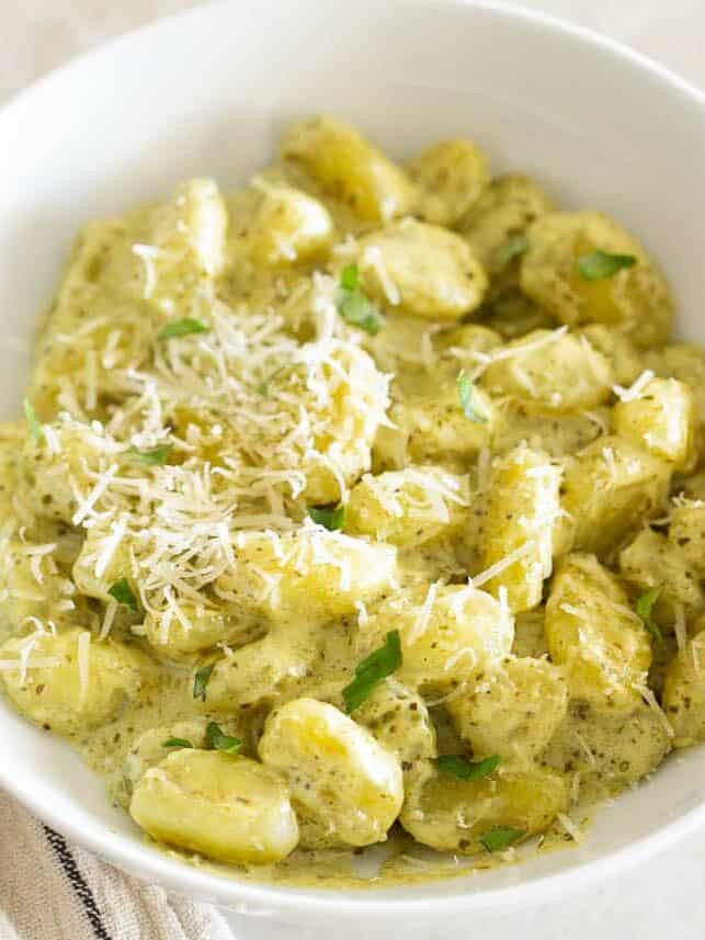 Pesto gnocchi in a serving bowl.
