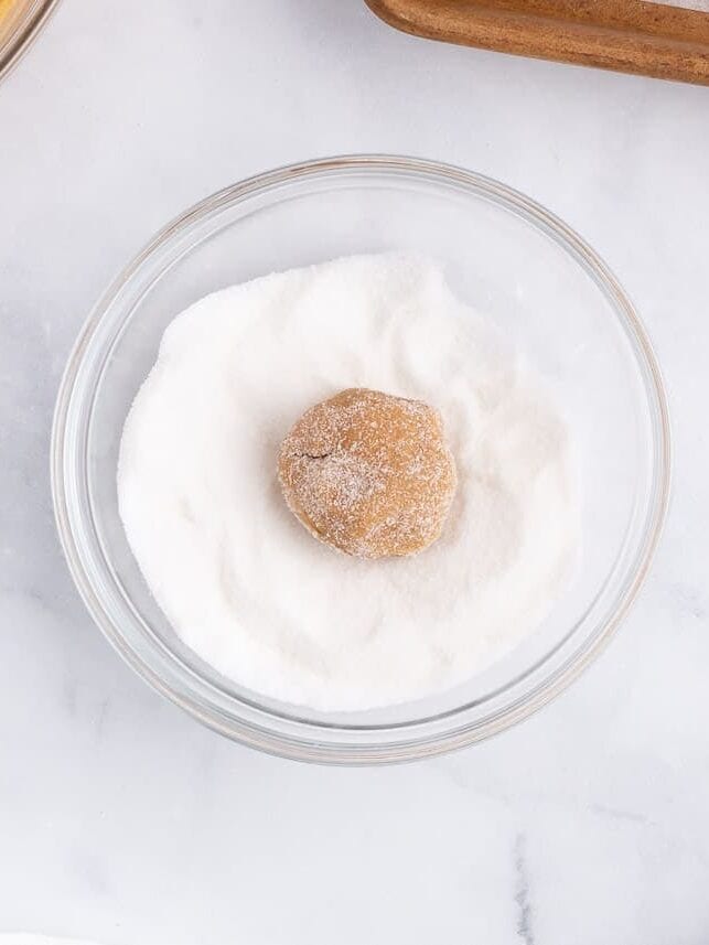 Peanut butter cookie dough ball rolled in sugar before baking.