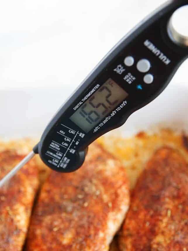 Instant read thermometer in baked chicken breast.