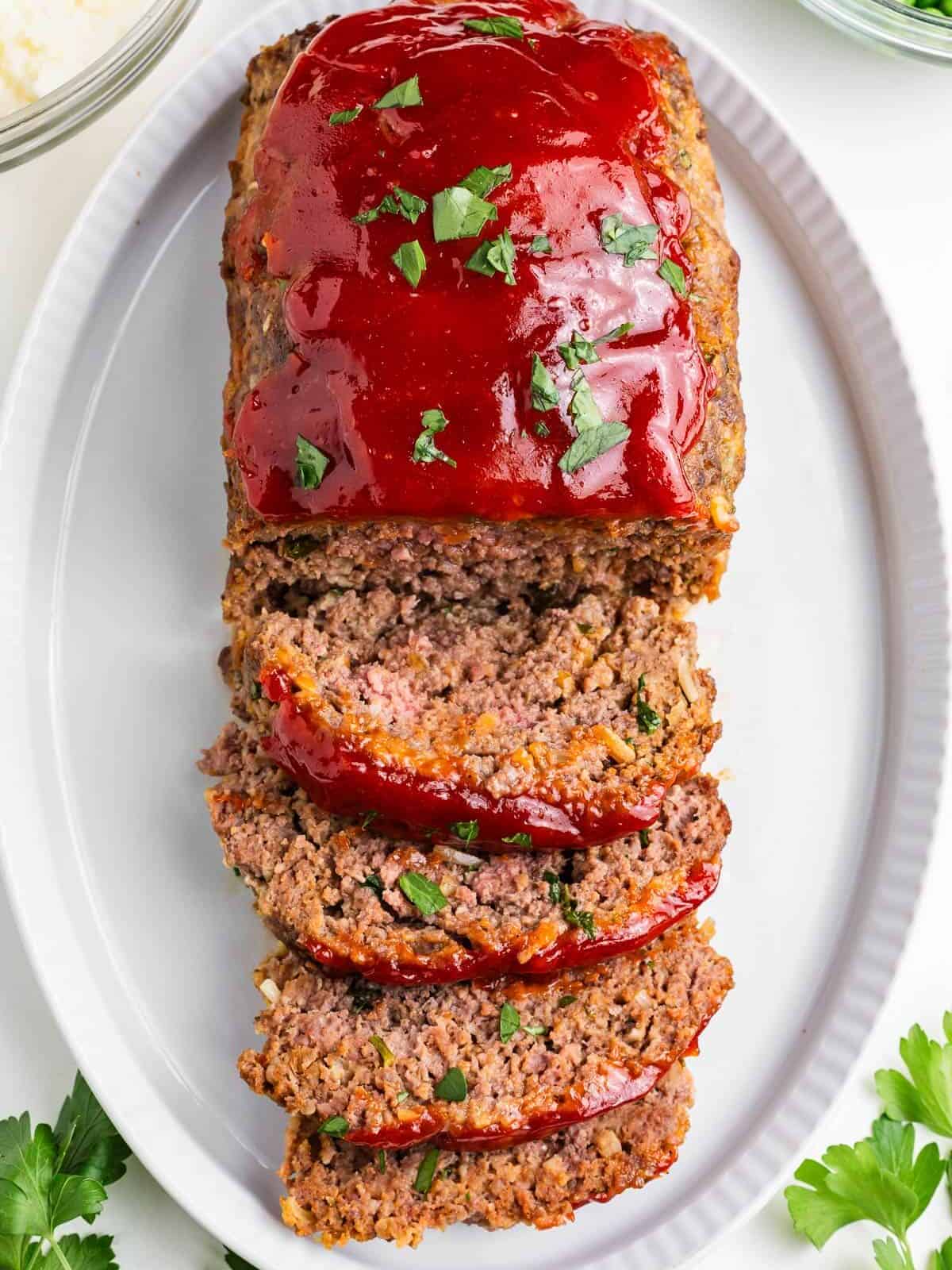 Sliced lipton onion soup meatloaf on a platter.