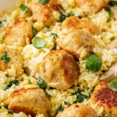 Golden chicken meatballs with creamy Parmesan orzo, spinach and fresh basil.
