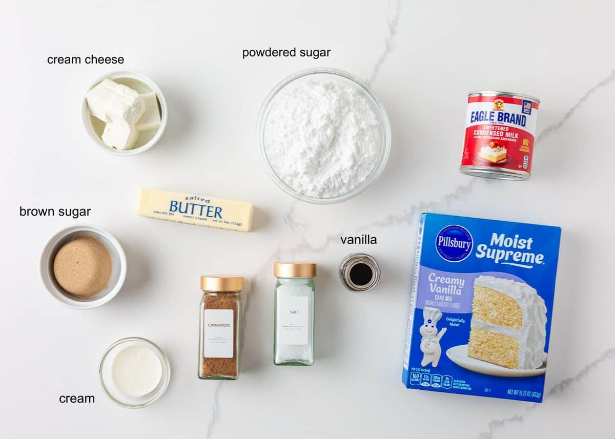 Ingredients for cinnamon roll poke cake on the counter.