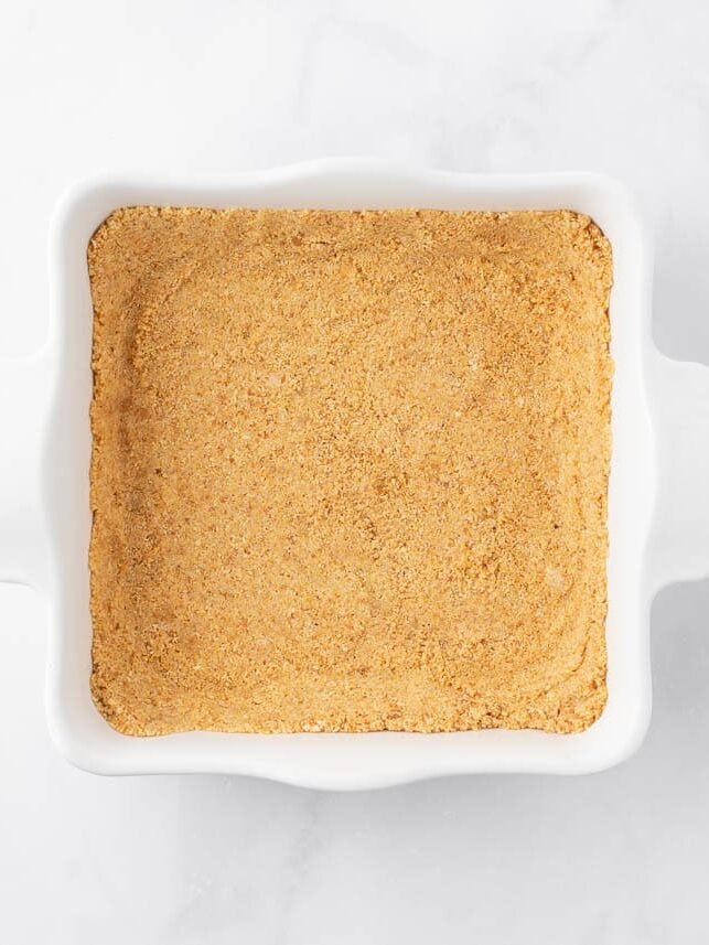 Graham cracker crust in baking dish.