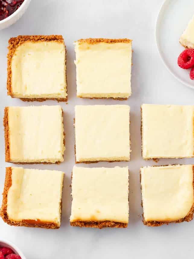 Cheesecake bars cut into squaress.