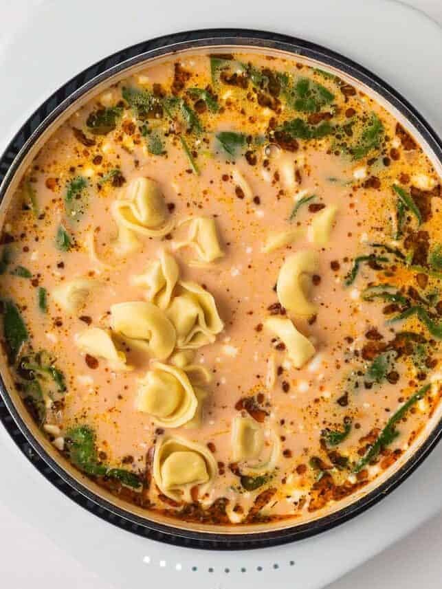 Cheese tortellini added to the creamy Italian sausage soup near the end of cooking.