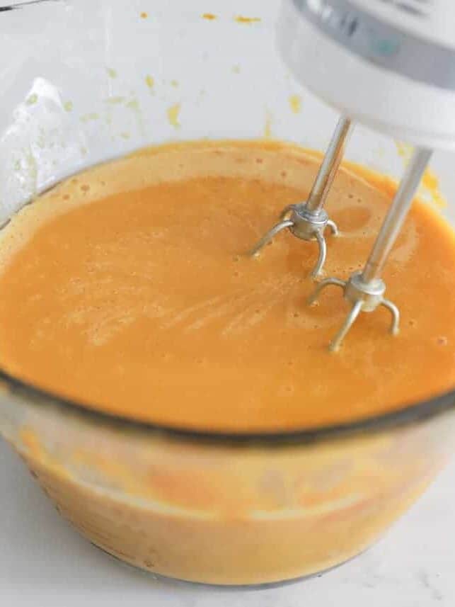 Pumpkin, oil, eggs being mixed together.