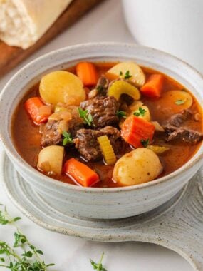 Bowl of chuck roast beef stew with tender beef, potatoes, carrots and celery.