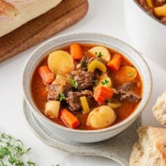 Homemade beef stew with chuck roast, potatoes and carrots served with crusty bread.
