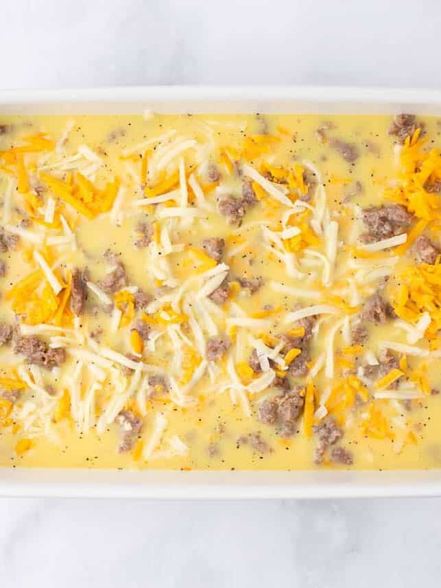 Egg mixture in white baking dish.