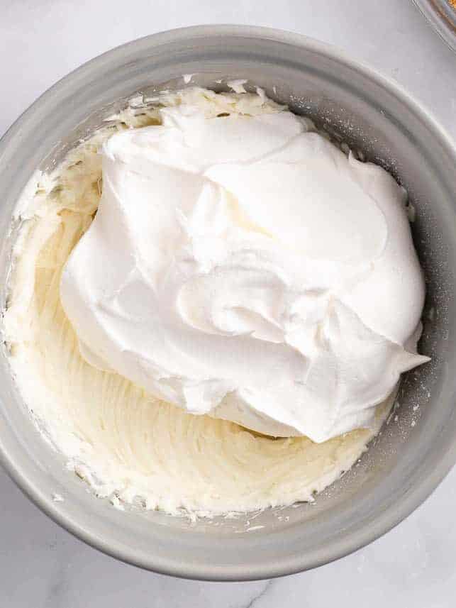 Whipped cream cheese in a bowl with Cool Whip.