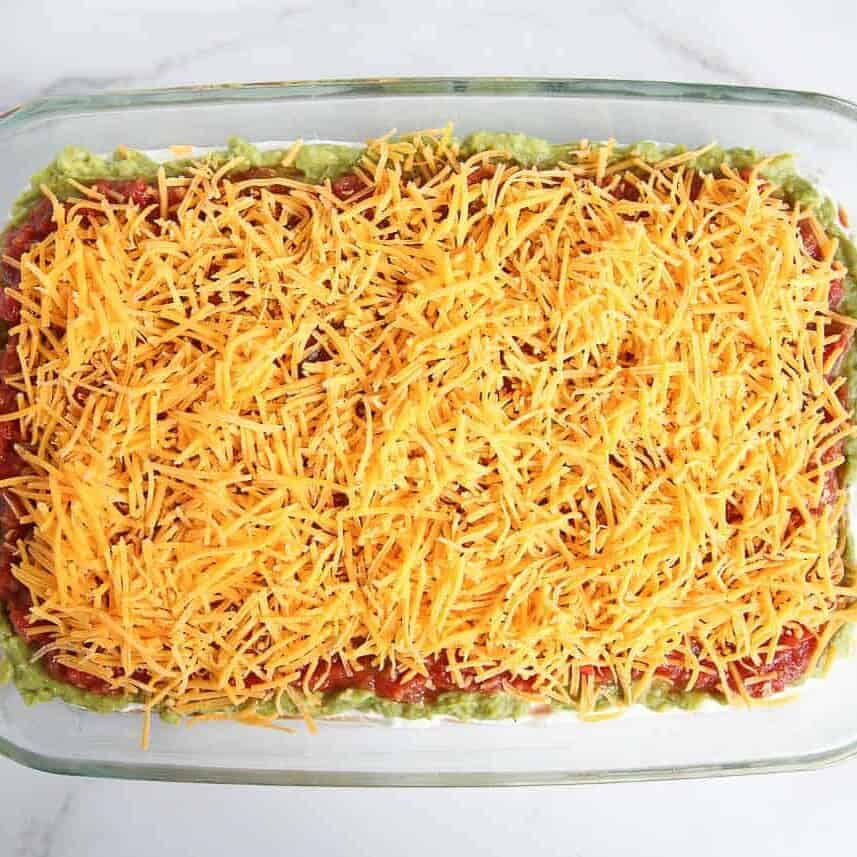 Cheese on top of salsa for 7 layer dip.
