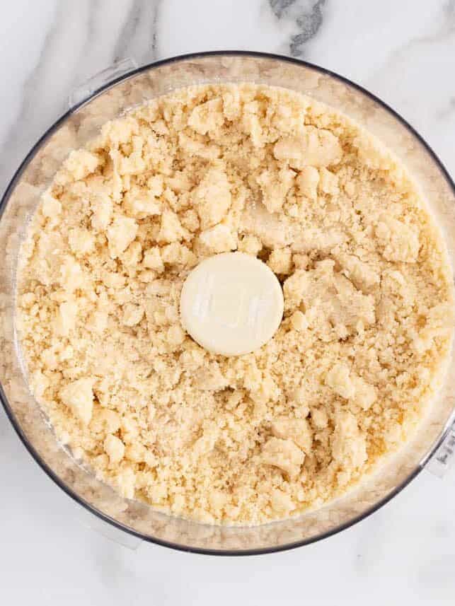 Making a shortbread crust in a food processor for pecan pie bars.