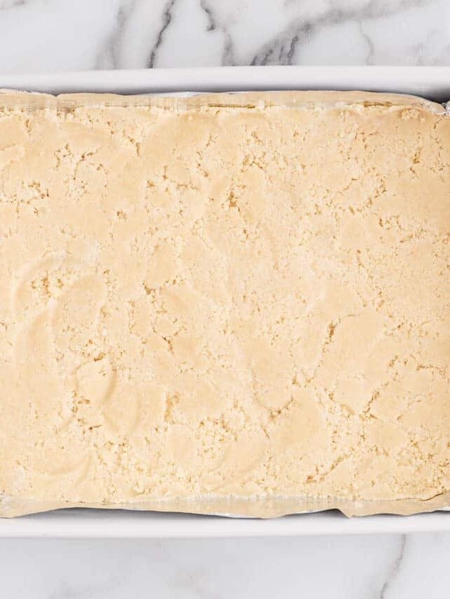Shortbread crust pressed into a 9x13 baking dish.