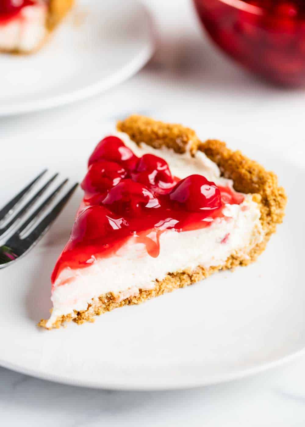 Slice of no bake cheesecake on plate.