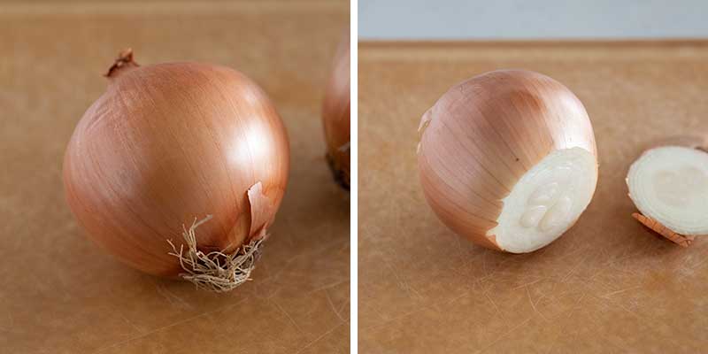 Cutting the ends of an onion.