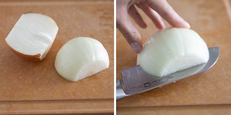 Cutting an onion in half.