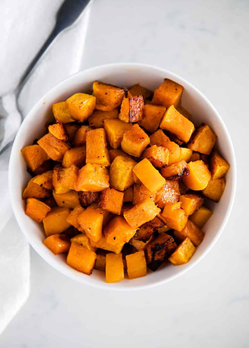 Roasted butternut squash in a bowl.