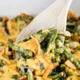 green bean casserole served with wooden spoon