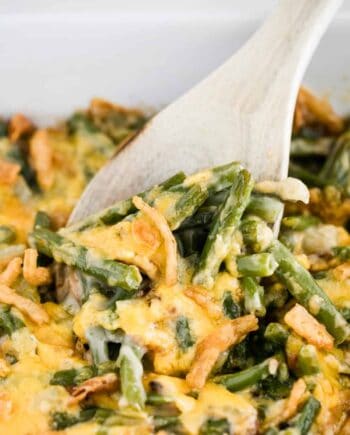 green bean casserole served with wooden spoon